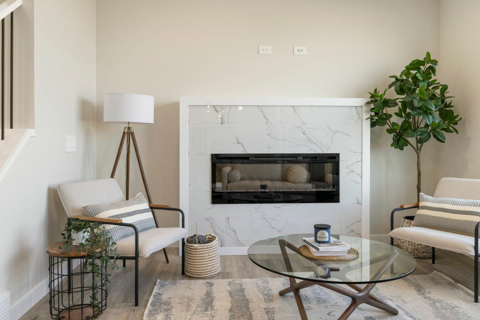 Living room with a tiled fireplace in a Golden Homes show home